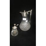 A clear glass claret jug with plated mounts and a similar atomizer