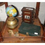 A 1920s oak cased desk calendar, a tin plate globe and similar items