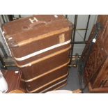 A Vintage wooden bound cabin trunk, an iron bracket and a decorative cast iron grill