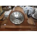 A 1920s oak cased mantel clock