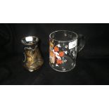 A clear glass mug painted with an enamel armorial and a similar vase