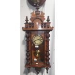 A late 19th century walnut cased wall clock