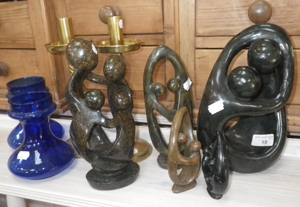 A pair of blue glass bulb vases, a pair of Gothic brass candlesticks and a collection of carved