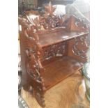 A Black Forest carved wooden shelf