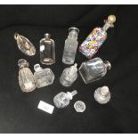 A collection of assorted dressing table bottles, including a number with silver fittings