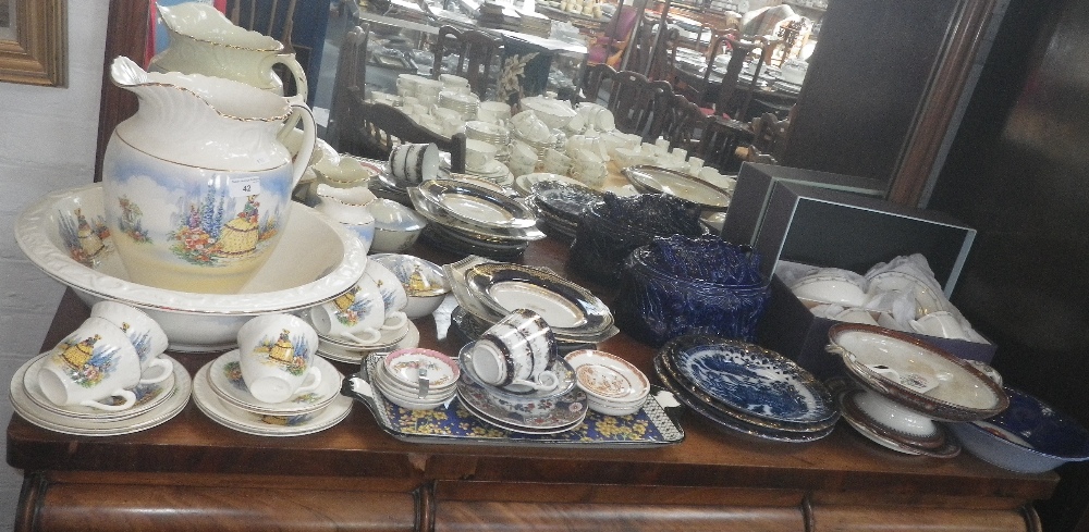 A 1930s jug and bowl set decorated with a crinoline lady, a similar tea set, ceramics including a