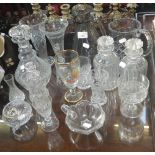 A cut glass decanter and a collection of similar glassware