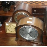 A 1930s Omega easel clock and two oak cased mantel clocks