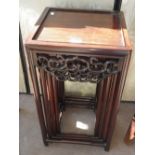 A nesting set of four Chinese hardwood tables with carved frieze rail