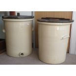 A pair of large 19th century glazed stoneware cisterns with tap holes and wooden lids