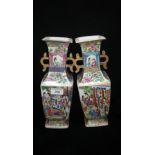 A pair of Chinese famille-rose square section vases