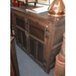 A 17th century oak cupboard with panel doors, 43" high x 53" wide