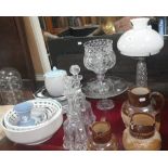 A cut glass cake stand, decanters and similar items