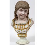 FRENCH BISQUE BUST OF CHILD, C. 1880, H 17 1/2"  W 10": A bust of a child, raised on a plinth