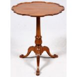 ENGLISH MAHOGANY TILT TOP TABLE, H 26 1/2'' L  22'': Round scalloped tilt top, raised on a  tri-