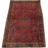 SAROUK WOOL RUG, W 3' 4", L 4' 9": Red ground  with designs in shades of blue, green and  yellow.