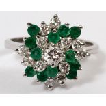 14KT WHITE GOLD, DIAMOND & EMERALD COCKTAIL  RING: A 14kt white gold mount set with a single  round