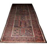 ORIENTAL BALUCHISTAN WOOL RUG, C. 1920-1930'S, W  4' 11", L 9' 9": Rust and blue dominant colors.