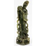 CHINESE SOAPSTONE FIGURE OF GUAN YIN, H 14":  Carved standing figure depicted holding a lotus