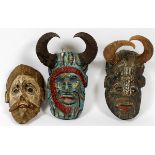 AFRICAN WOOD CARVED MASKS, 3 PCS, H 9" - 14":  painted masks depicting two men with horns, one