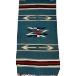 MEXICAN WOVEN MAT, 38" X 19": Turquoise ground,  arrow motif.