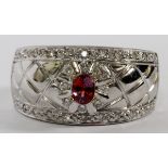 18KT WHITE GOLD, GARNET & DIAMOND RING, SIZE 6  1/4: Stamped "750", wide band. Size 6 1/4.  Weighs