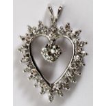 0.85CT DIAMOND & GOLD LADY'S HEART PENDANT, L  1": A 14kt white gold lady's heart form  pendant,