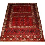 TURKOMAN ORIENTAL RUG, CIRCA 1940, 4' 8" X 6':  Red field. Black and white accents. Finely  woven.