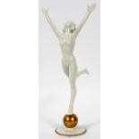 HUTSCHENREUTHER PORCELAIN NUDE FIGURE, H 13":  Art deco style nude in joyous stance atop a  golden