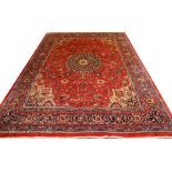 SAROUK WOOL RUG, W 9' 8", L 13' 6": Red ground  with central medallion and multi-colored flower