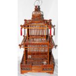 CHINESE, WOOD BIRD CAGE, H 27", L 13.25",:  Chinese wood bird cage, having a tiered pagoda