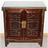 CHINESE TWO DOOR CABINET, H 27.25", L 26.5", D  14": Having reticulated panel doors and a glass