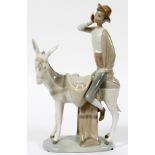 LLADRO PORCELAIN FIGURE, H 11", W 6", BOY ON  DONKEY: Depicting a boy riding a donkey, marked  at