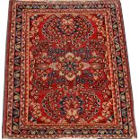 PERSIAN SAROUK WOOL MAT, C. 1920-1940, W 1' 11",  L 2' 4": Red field having a semi-centralized