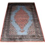 PAKISTANI BOKHARA WOOL RUG, C. 1980, W 4' 1", L  6' 0": Blue open field wit a large central  floral