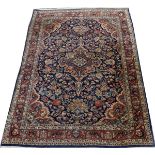 KASHAN PERSIAN RUG, C. 1930, 5' 2" X 3' 7":  Navy ground with central medallion and overall  floral