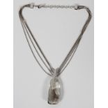 SWAROVSKI CRYSTAL PENDANT NECKLACE, L 16": A  four-strand neck chain hung with a faceted  crystal