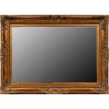 GILT WOOD FRAMED WALL MIRROR, H 44", W 32":  Mirror set into a carved gilt wood frame. Mirror  is