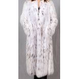 NATURAL RUSSIAN LYNX COAT: Belly fur, with  three hook closures and fuchsia lining. Circa  2008-