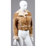 LADY'S SHEARLING JACKET, L 23": Fitted with  four pockets, and an open pocket at each side.