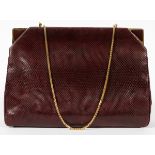 JUDITH LEIBER LIZARD SHOULDER BAG, W 10": A  burgundy lizard bag with gold tone accents,  opening to