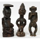 AFRICAN, CARVED WOOD FIGURES, 3 PCS., H 9" & 10": Featuring a monkey form H 9 1/2", L 3"; a seated