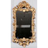 FRENCH GILT GESSO OVER WOOD WALL MIRROR, 19TH C., H 48", W 25": Pierced shell motif frame. Purchased
