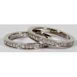 EDWARD CHIU, 1.50CT DIAMOND & GOLD, TWIN ETERNITY BANDS, SIZE 6: A pair of 18kt white gold