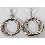 1.26CT DIAMOND ROLLING RING DANGLE EARRINGS, PAIR, L 1 5/8": A pair of 14kt white gold lady's