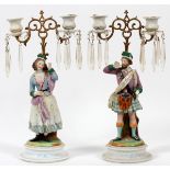 GERMAN PORCELAIN FIGURAL CANDELABRA, LATE 19TH C., PAIR, H 15", W 8".: Each is modeled as a Scotsman