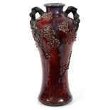 ORIENTAL SANG DE BOEUF GLAZED POTTERY VASE, H 16", SIGNED: A baluster form vase, flanked by twisted,