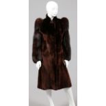 LADY'S SEAL & FOX FUR COAT, L 45", FOUKE: A lady's seal fur coat, with fox sleeves. Labeled: