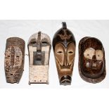 AFRICAN TRIBAL CARVED WOOD MASKS, 20TH C., FOUR, H 13" - 20": Including one Wagoma Congo mask,