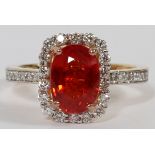 2.48CT NATURAL ORANGE SAPPHIRE & DIAMOND RING, SIZE 6.5: A 14kt gold lady's ring, featuring a 2.48